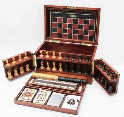 Дорожный набор настольных игр, компактно размещенных в специальной деревянной шкатулке с раздвижными створками, дополнительными вставками, креплениями и съемными полочками для хранения и транспортировки. 1880 - 1900-е гг. Западная Европа: